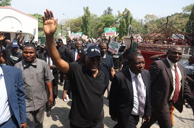 Candidate of Nigeria's People's Democratic Party, Atiku Abubakar leads supporters in protest of the results of the presidential and general election in Abuja on Monday. 